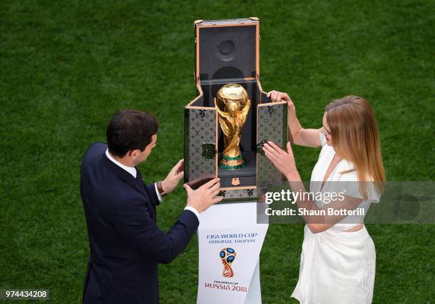 Spain legend Iker Casillas and model Natalia Vodianova show the World Cup trophy prior to the 2018 FIFA World Cup Russia Group A match between Russia...