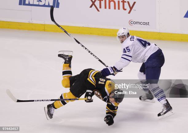 Viktor Stalberg of the Toronto Maple Leafs shoves Marc Savard of the Boston Bruins on March 4, 2010 at the TD Garden in Boston, Massachusetts.