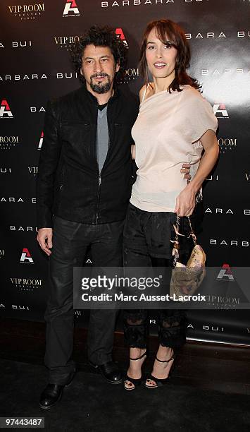 Radu Mihaileanu and Dolores Chaplin attend the Barbara Bui Party at VIP Room Theatre on March 4, 2010 in Paris, France.