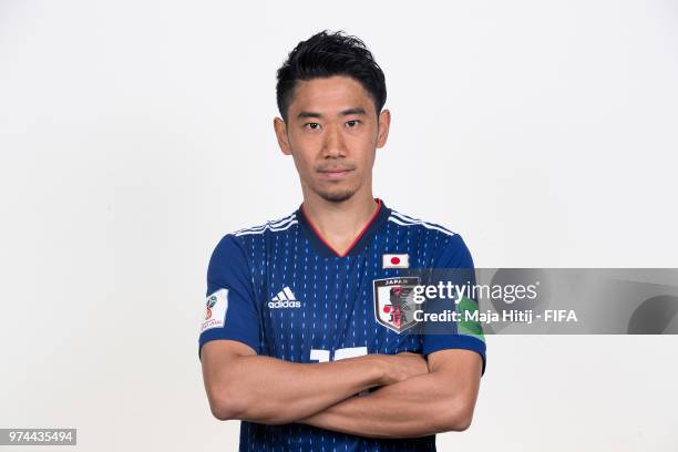 Shinji Kagawa of Japan poses for a portrait during the official FIFA World Cup 2018 portrait session at the FC Rubin Training Grounds on June 14,...