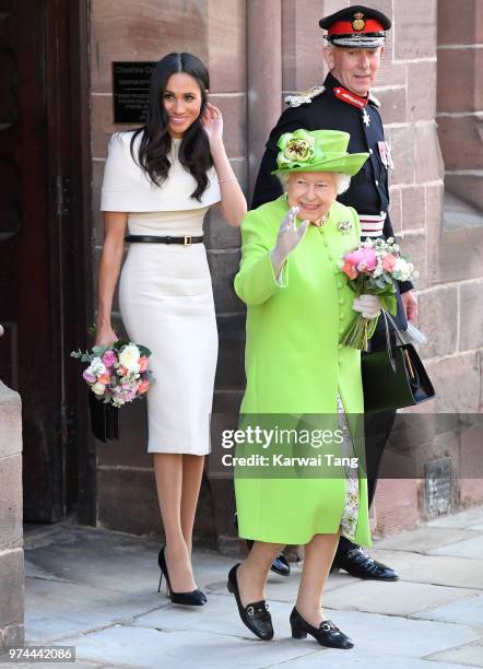 Meghan, Duchess of Sussex and Queen Elizabeth II depart Chester Town Hall, where they attended lunch as guests of Chester City Council on June 14,...