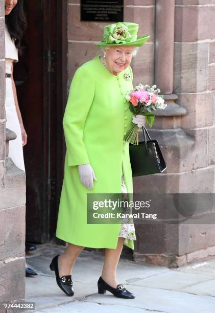 Queen Elizabeth II departs Chester Town Hall, where she attended lunch with Meghan, Duchess of Sussex as guests of Chester City Council on June 14,...