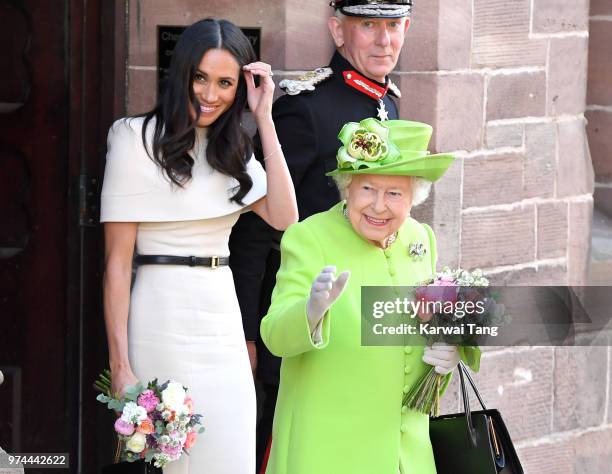 Meghan, Duchess of Sussex and Queen Elizabeth II depart Chester Town Hall, where they attended lunch as guests of Chester City Council on June 14,...