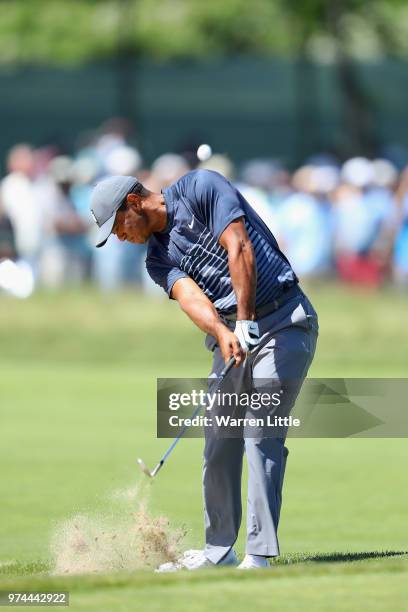 Tiger Woods of the United States plays his second shot on the fourth hole during the first round of the 2018 U.S. Open at Shinnecock Hills Golf Club...