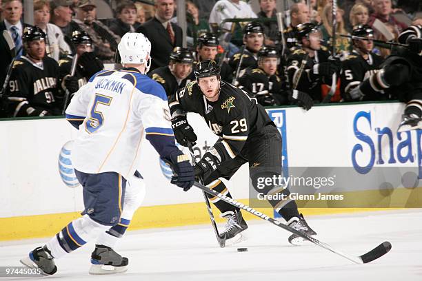 Steve Ott of the Dallas Stars handles the puck against Barret Jackman of the St. Louis Blues on March 4, 2010 at the American Airlines Center in...