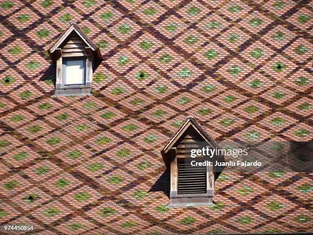 mosaic roof with two windows, besancon, france - besancon photos et images de collection