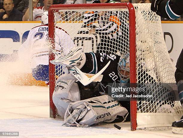 Evgeni Nabokov of the San Jose Sharks makes a save against the Montreal Canadiens during an NHL game at the HP Pavilion on March 4, 2010 in San Jose,...