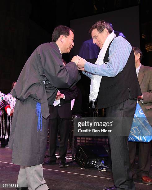 Musician Philip Glass recieves a traditional khata scarf at Thank You Tibet! at the Cathedral of St. John the Divine on March 4, 2010 in New York...