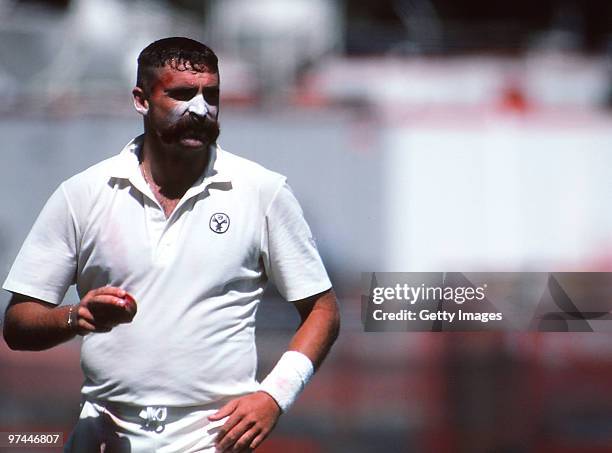 Merv Hughes of Australia prepares to bowl on December 26, 1990 in Australia.