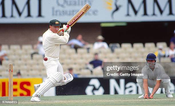 Ian Healy of Australia bats as Alec Stewart of England fields in-close on January 8, 1991 in Australia.