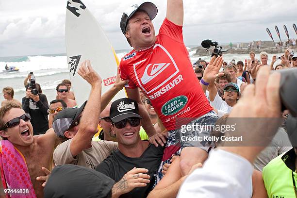 Taj Burrow of Australia celebrates after winning the Quiksilver Pro final against Jordy Smith of South Africa, the Quiksilver Pro 2010 is part of the...