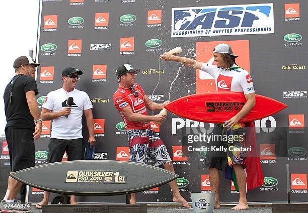 Taj Burrow of Australia and Jordy Smith of South Africa celebrate on stage after the Quiksilver Pro final, the Quiksilver Pro 2010 is part of the ASP...