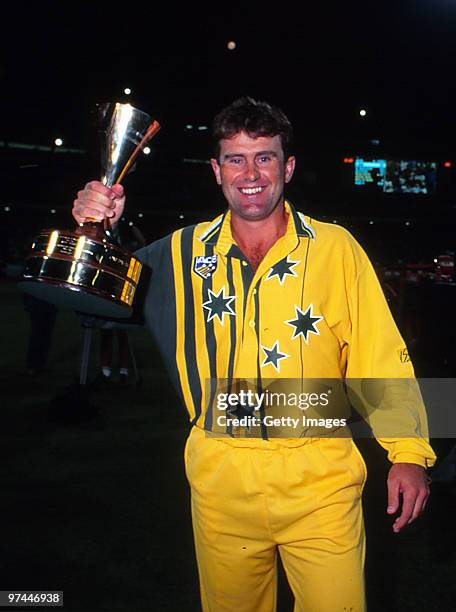 Mark Taylor of Australia holds series trophy after winning the second One Day International Final on January 17, 1994 in Australia.