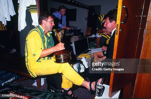 Mark Taylor of Australia celebrates after a One Day International series win with the trophy on January 17, 1995 in Australia.