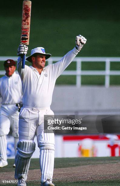 Mark Taylor of New South Wales celebrates reaching his double century in a Sheffield Shield match against Queensland on March 25, 1990.