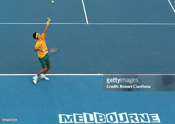 Bernard Tomic of Australia serves in his match against Tsung-Hua Yang of Chinese Taipei during day of the Davis Cup Asia-Oceania Zone Group 1 tie...