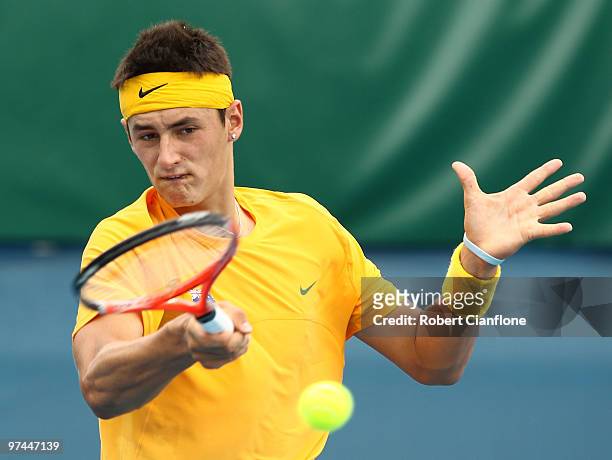 Bernard Tomic of Australia plays a forehand in his match against Tsung-Hua Yang of Chinese Taipei during day of the Davis Cup Asia-Oceania Zone Group...