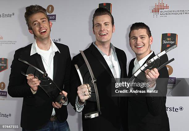 The singers Digger, Sam and Basti of the band The Baseballs pose with the award at the Echo award 2010 at the Messe Berlin on March 4, 2010 in...