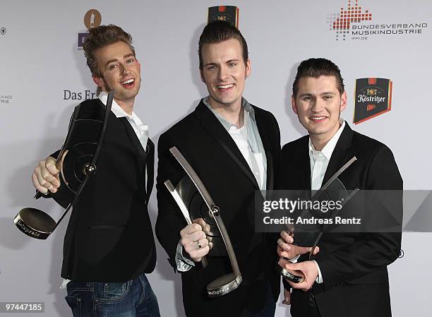 The singers Digger, Sam and Basti of the band The Baseballs pose with the award at the Echo award 2010 at the Messe Berlin on March 4, 2010 in...