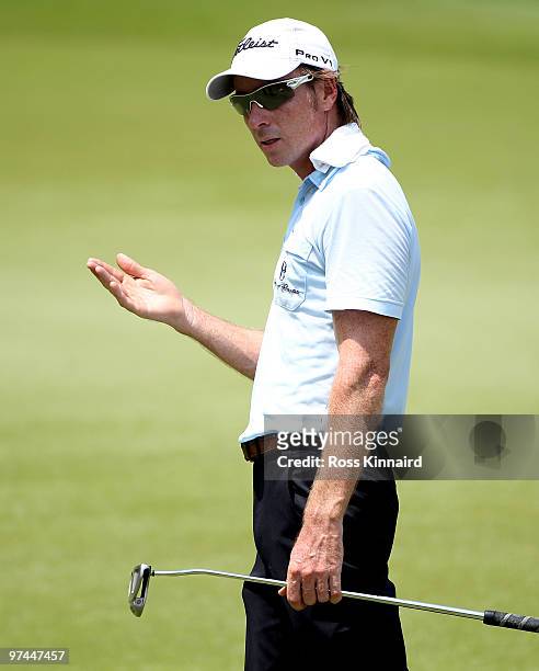 Brett Rumford of Australia gestures on the 18th hole during the second round of the Maybank Malaysia Open at the Kuala Lumpur Golf & Country on March...