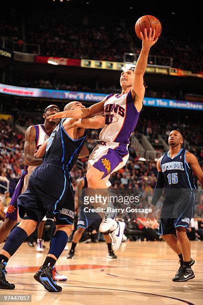 Steve Nash of the Phoenix Suns drives for a shot against Carlos Boozer of the Utah Jazz in an NBA Game played on March 4, 2010 at U.S. Airways Center...