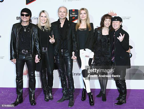 Matthias Jabs, Rudolf Schenker and Klaus Meine of the band Scorpions and their wifes arrive at the Echo award 2010 at the Messe Berlin on March 4,...