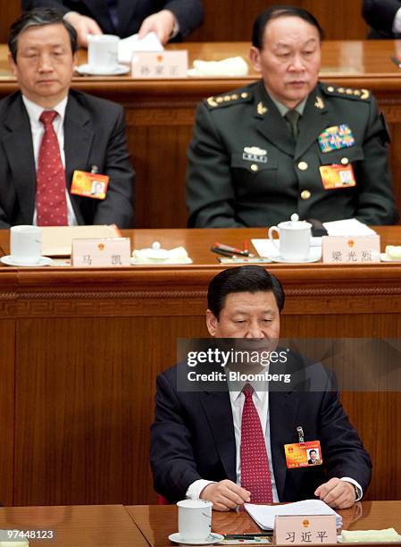 Xi Jinping, China's vice president attends the opening session of the National People's Congress at the Great Hall of the People in Beijing, China,...