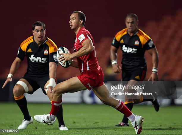 Quade Cooper of the reds attacks during the round four Super 14 match between the Chiefs and the Reds at Waikato Stadium on March 5, 2010 in...