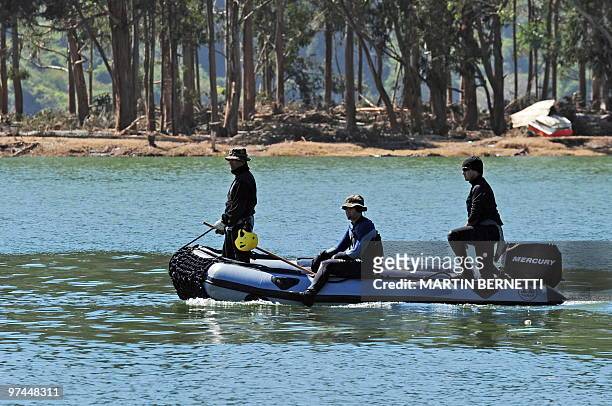 Chilean divers search for corpses in Constitucion, some 300 km south of Santiago, March 4, 2010. The official death toll from Saturday's...