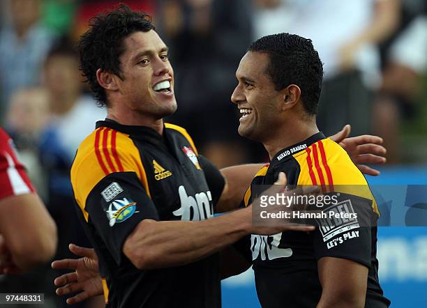Lelia Masaga celebrates with Callum Bruce of the Chiefs after scoring during the round four Super 14 match between the Chiefs and the Reds at Waikato...