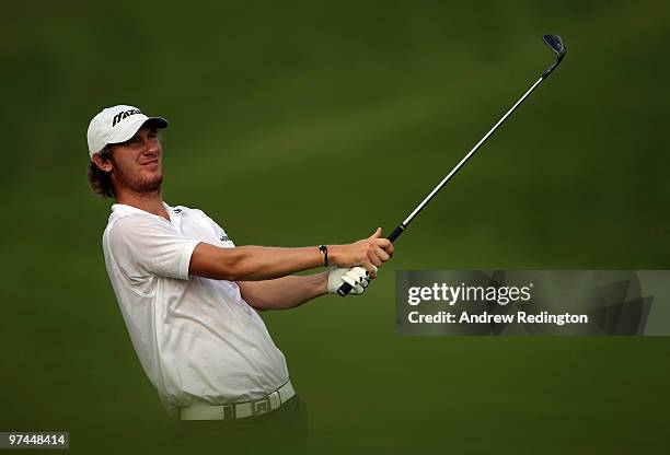 Chris Wood of England plays his second shot on the 14th hole during the the second round of the Maybank Malaysian Open at the Kuala Lumpur Golf and...