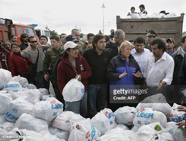 Chilean President Michelle Bachelet talks with volunteers during a visit to a humanitarian aid center in Concepcion, Chile on March 04, 2010. The...
