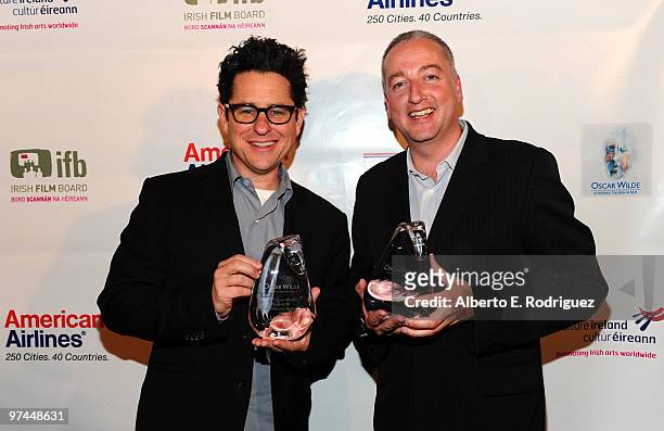 Director/producer/writer J.J. Abrams poses with the Oscar Wilde honorary Irishman award and cinematographer Seamus McGarvey poses with the Oscar...