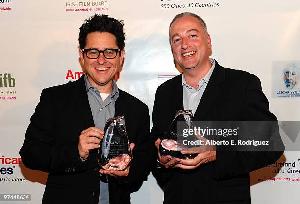 Director/producer/writer J.J. Abrams poses with the Oscar Wilde honorary Irishman award and cinematographer Seamus McGarvey poses with the Oscar...