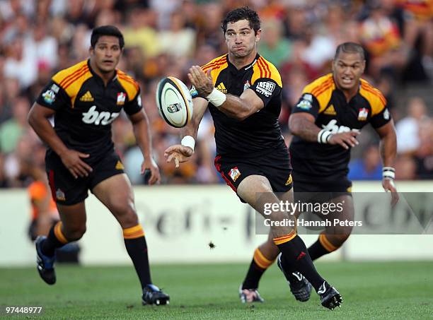 Stephen Donald of the Chiefs passes the ball out during the round four Super 14 match between the Chiefs and the Reds at Waikato Stadium on March 5,...