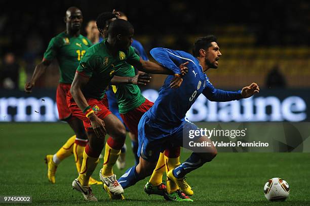 Marco Borriello of Italy battles for the ball with Sebastien Bassong of Cameroon during the International Friendly match between Italy and Cameroon...