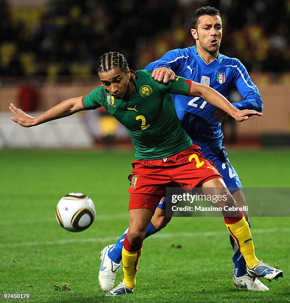 Fabio Quagliarella of Italy battles for the ball against Benoit Assou Ekotto of Cameroon during the International Friendly match between Italy and...