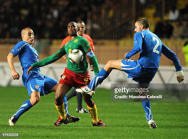 Fabio Cannavaro and Leonardo Bonucci of Italy battles for the ball against Samuel Eto'o Fils of Cameroon during the International Friendly match...