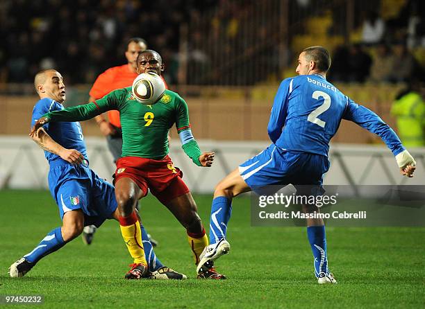 Fabio Cannavaro and Leonardo Bonucci of Italy battles for the ball against Samuel Eto'o Fils of Cameroon during the International Friendly match...