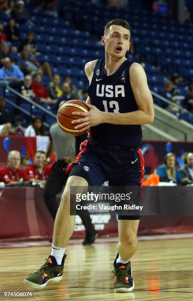 Matthew Hurt of the United States dribbles the ball during the second half of a FIBA U18 Americas Championship group phase game against Puerto Rico...