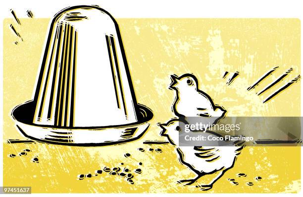 two small chicks eating pallets from a feeder - bird feeder stock illustrations