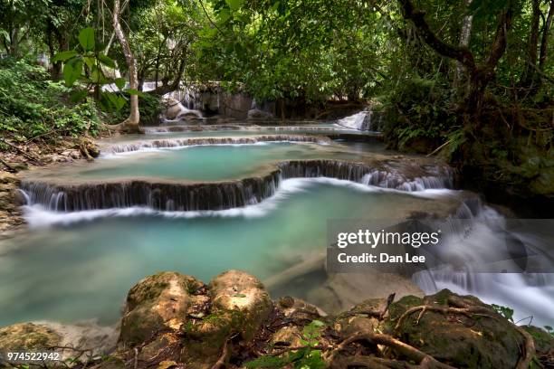 out of the blue - kuang si falls stock pictures, royalty-free photos & images