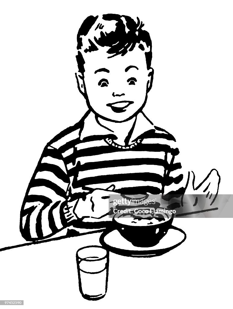 A black and white version of a young boy enjoying his dinner