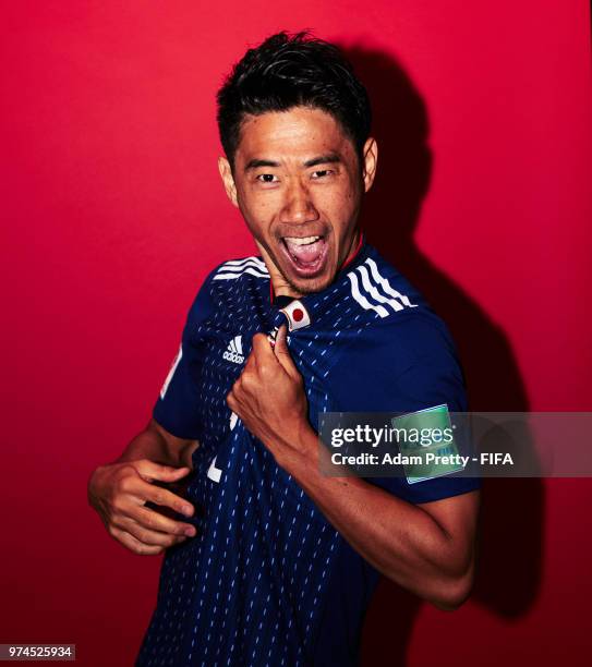 Shinji Kagawa of Japan poses for a portrait during the official FIFA World Cup 2018 portrait session at the FC Rubin Training Grounds on June 14,...