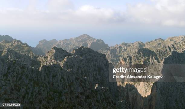 rocky canyon landscape on sunny day, serra de tramuntana, palma de mallorca, spain - sierra de tramuntana stock pictures, royalty-free photos & images