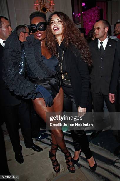 Grace Jones and Afef Jnifen attend the Victor & Rolf 'Flower Bomb' 5th Anniversary Party at Hotel Meurice on March 4, 2010 in Paris, France.