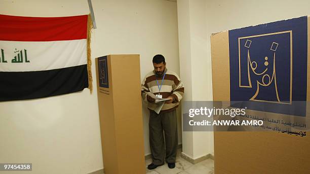 An Iraqi refugee casts his vote for the Iraqi general election at a polling station in Beirut on March 5, 2010. Politicians launched into their last...