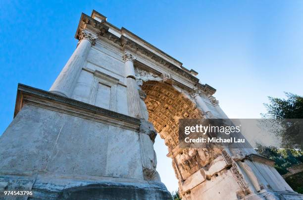 low angle view of arch of titus, rome, italy - arch of titus stock pictures, royalty-free photos & images