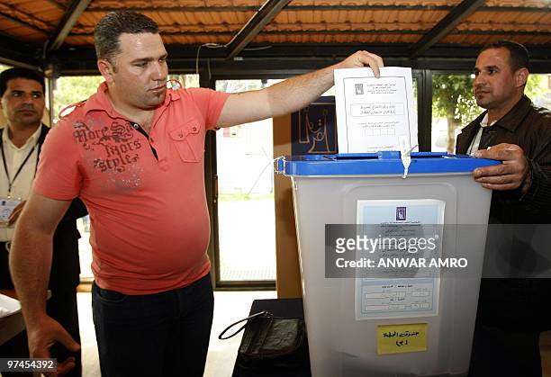 An Iraqi man casts his ballot for the Iraqi general election at a polling station in Beirut on March 5, 2010. Politicians launched into their last...