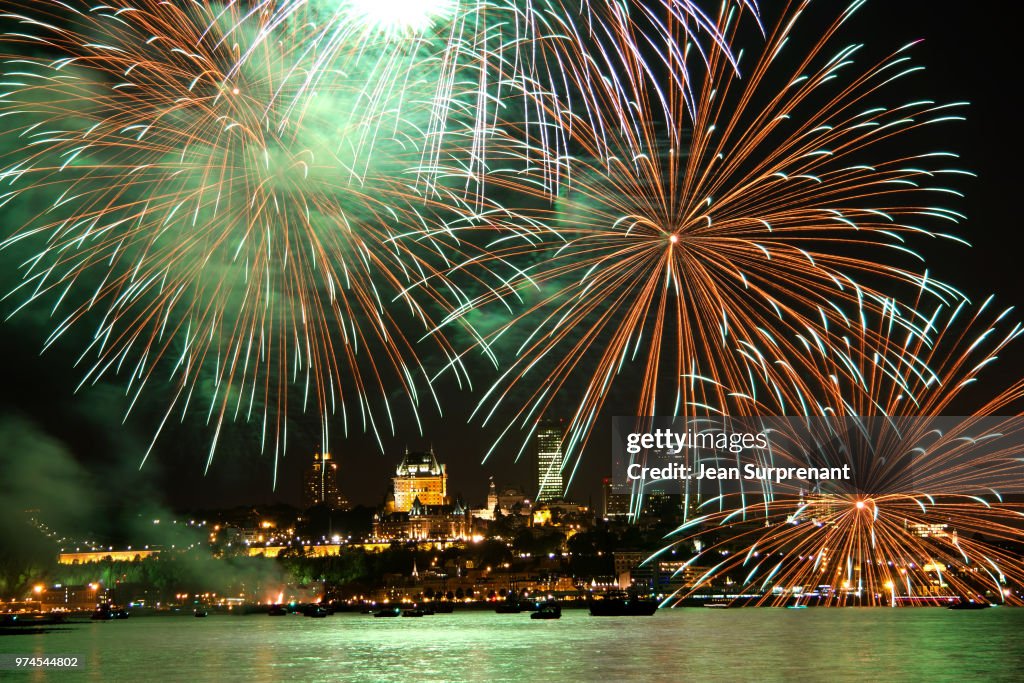 Fireworks display over city waterfront